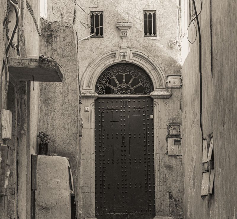 Carved door in alleyway in Rabat