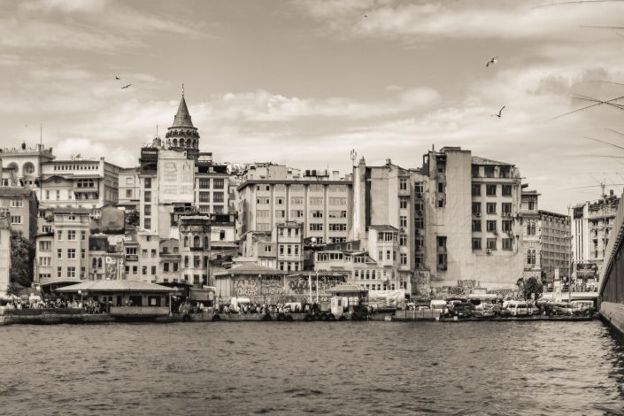 View of Istanbul and the fishing rods at Galata bridge