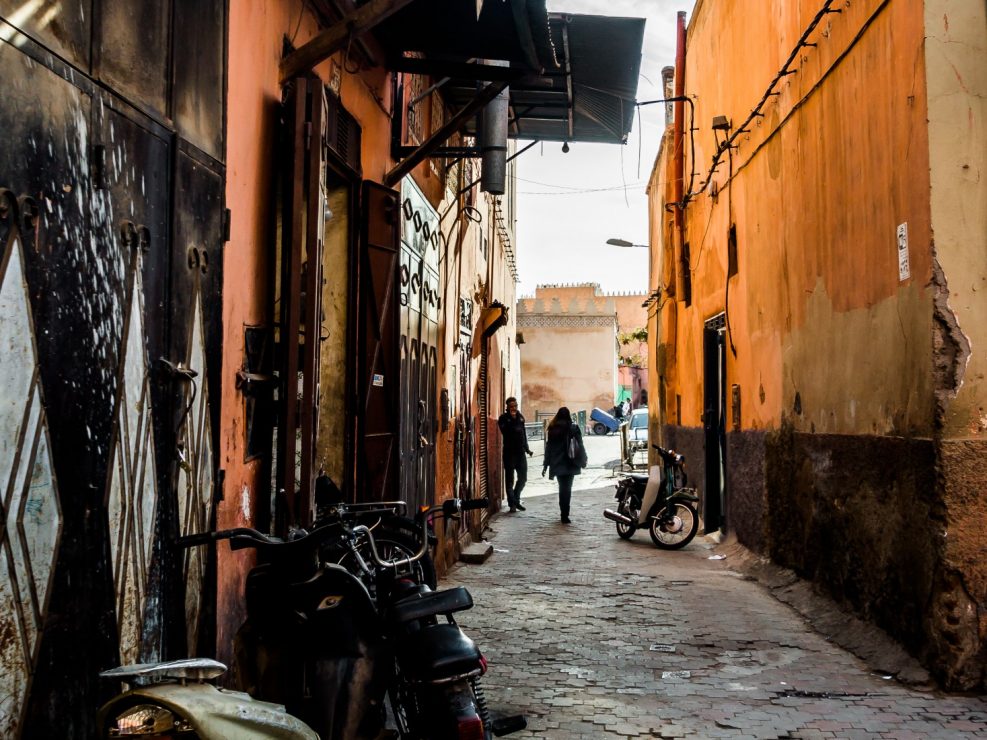 Marrakesh side narrow street showing motorbikes