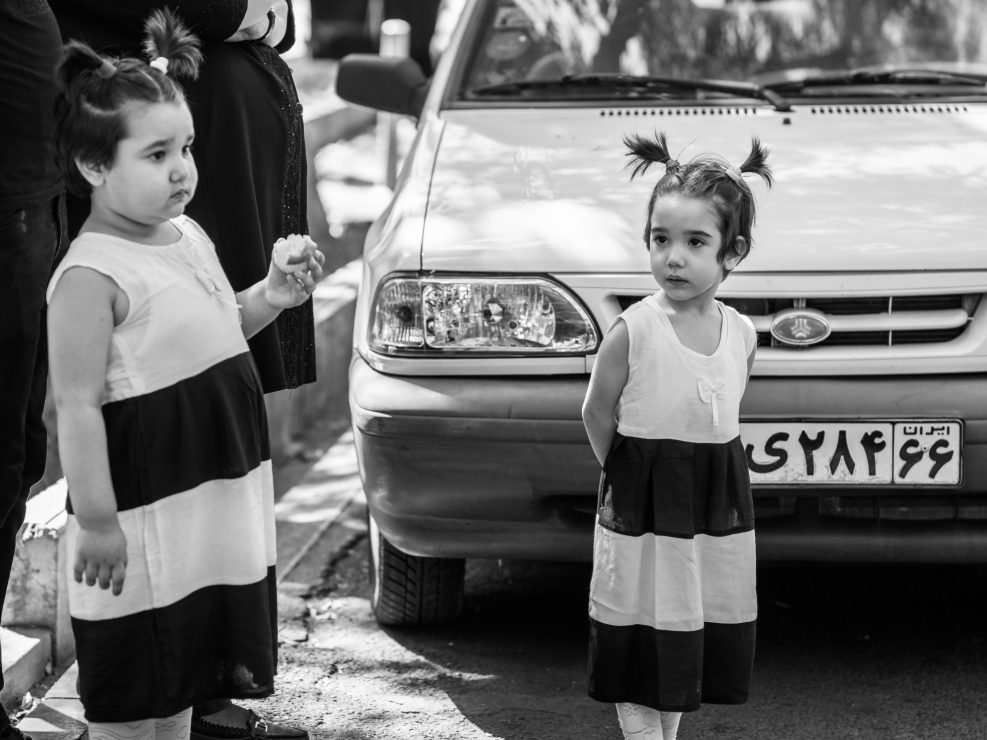 Two little girls identically dressed during Ashura, Iran