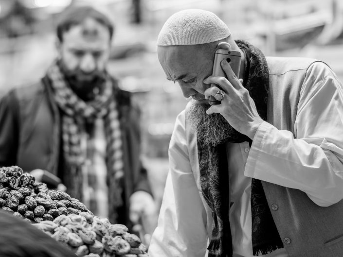 Turkish Imam on the phone, Istanbul bazar