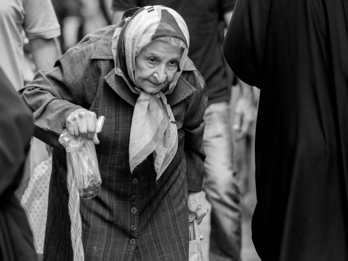 Old lady with cane shopping, Tajrish Bazar, Iran