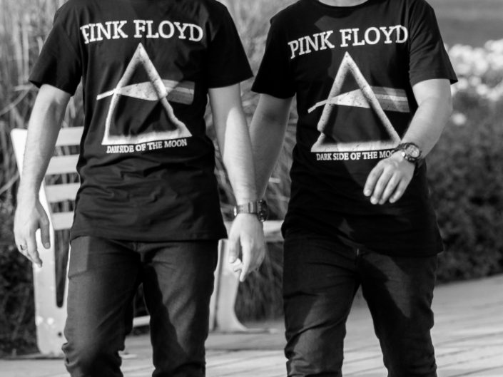 Two identical youth wearing matching Pink Floyd t-shirts