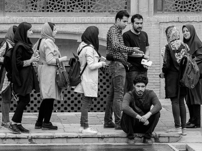 Sad Young university student among loud group Iran
