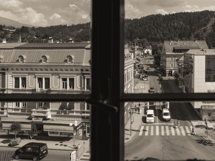 Looking through a window at a mountainous village