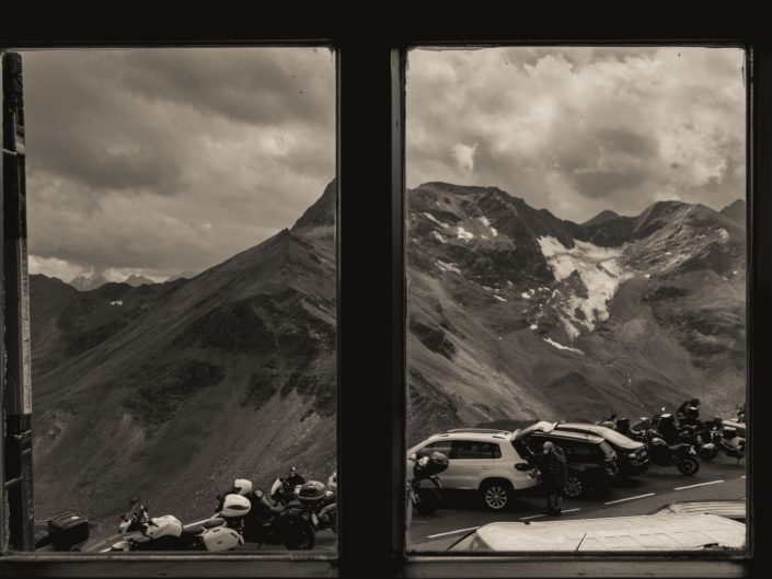 Looking through a window at a mountainous road